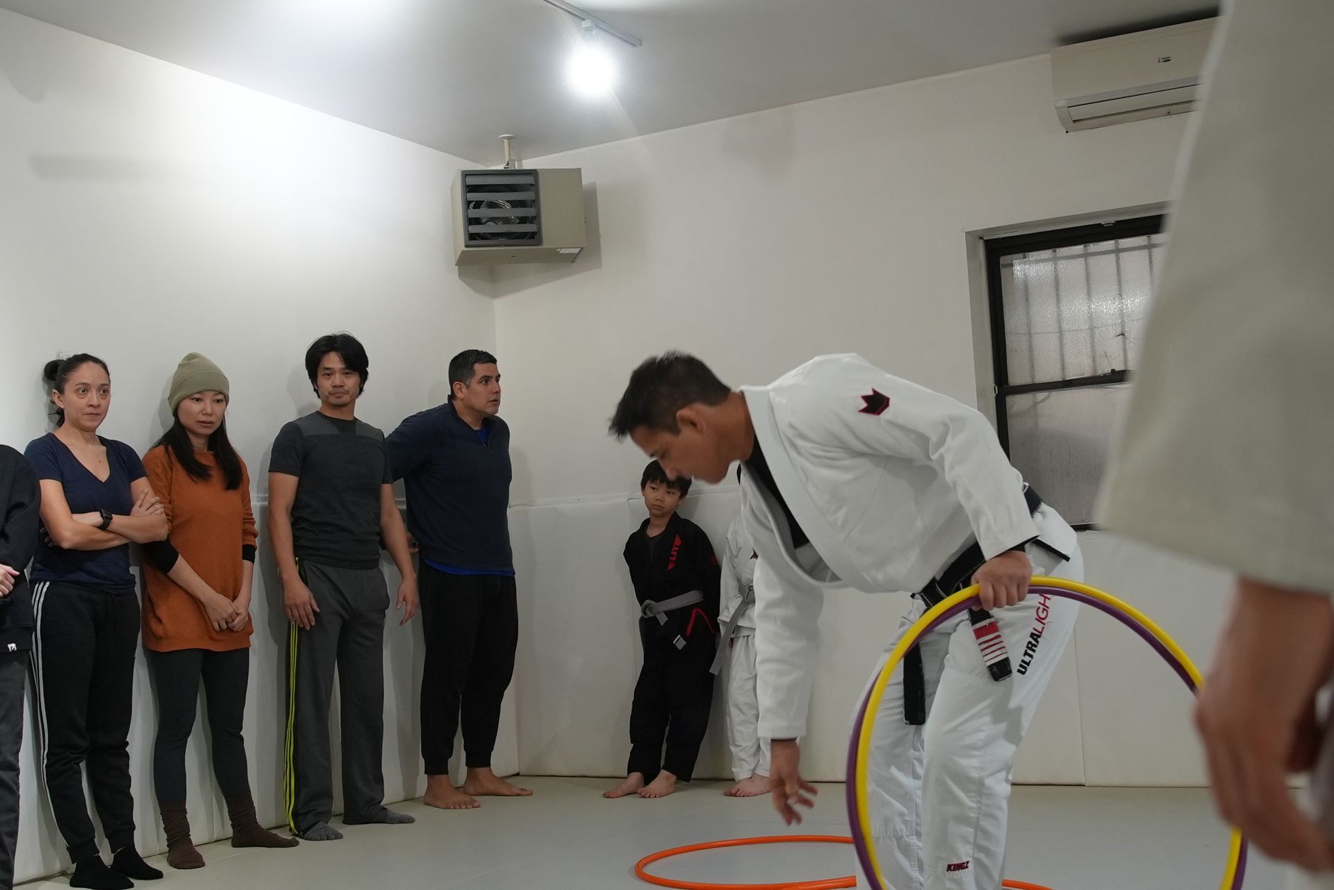 Students drilling Brazilian Jiu-Jitsu at Range Brazilian Jiu-Jitsu NYC in New York, NY for strength and stress relief
