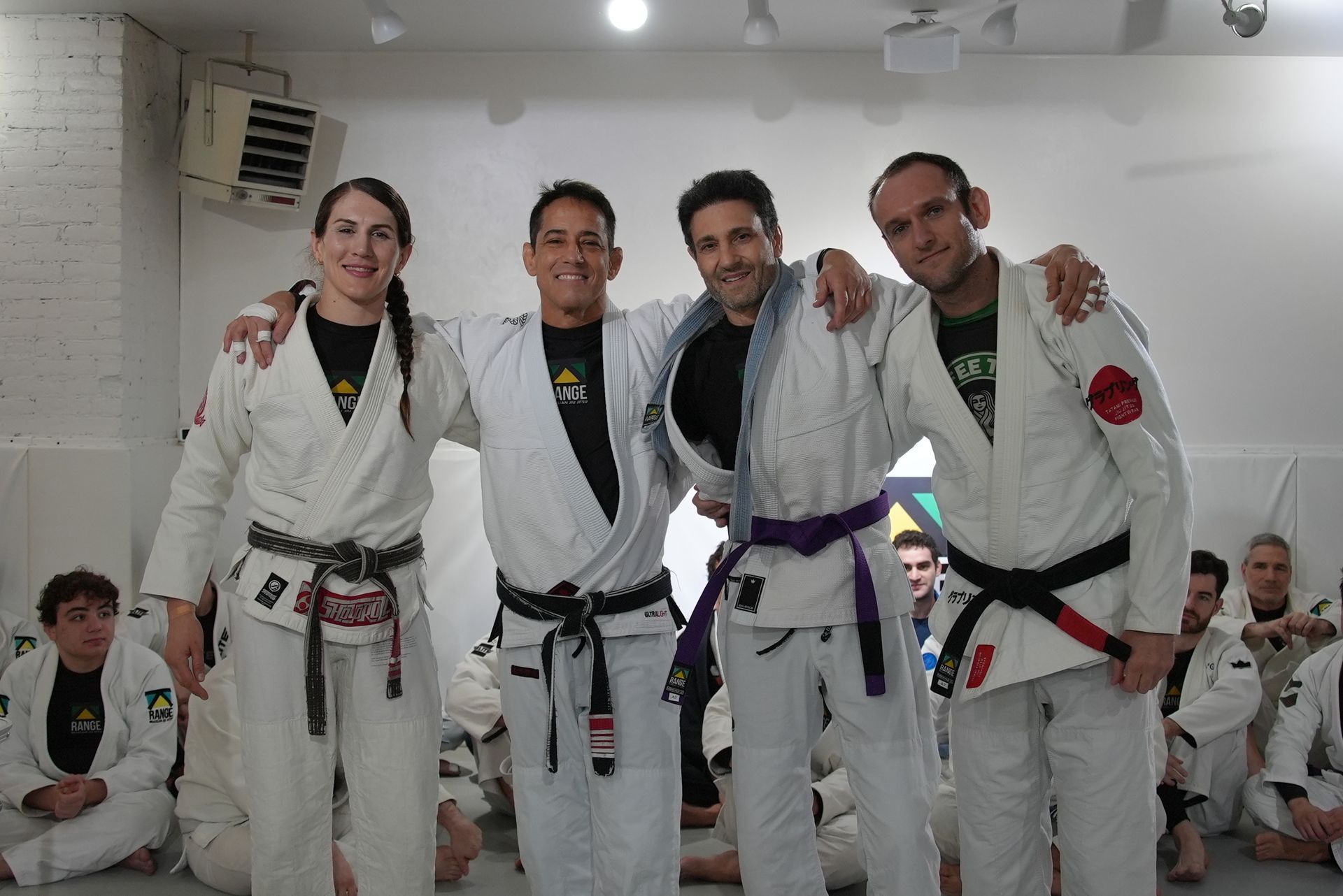 Adults drilling Brazilian Jiu-Jitsu techniques at Range Brazilian Jiu-Jitsu NYC in New York, NY for fitness and focus