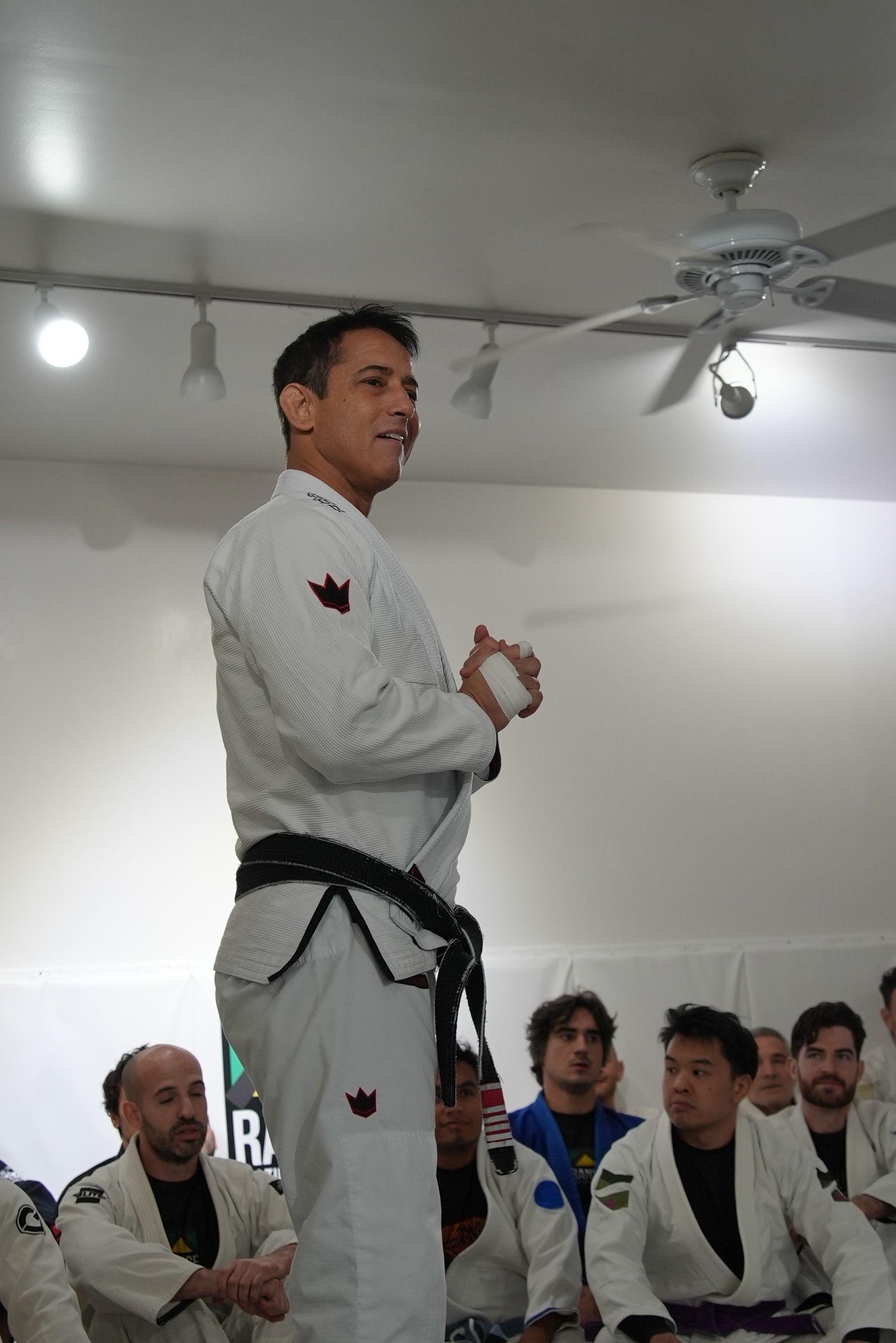 Adults practice Brazilian Jiu-Jitsu drills at Range Brazilian Jiu-Jitsu NYC in New York, building calm focus.