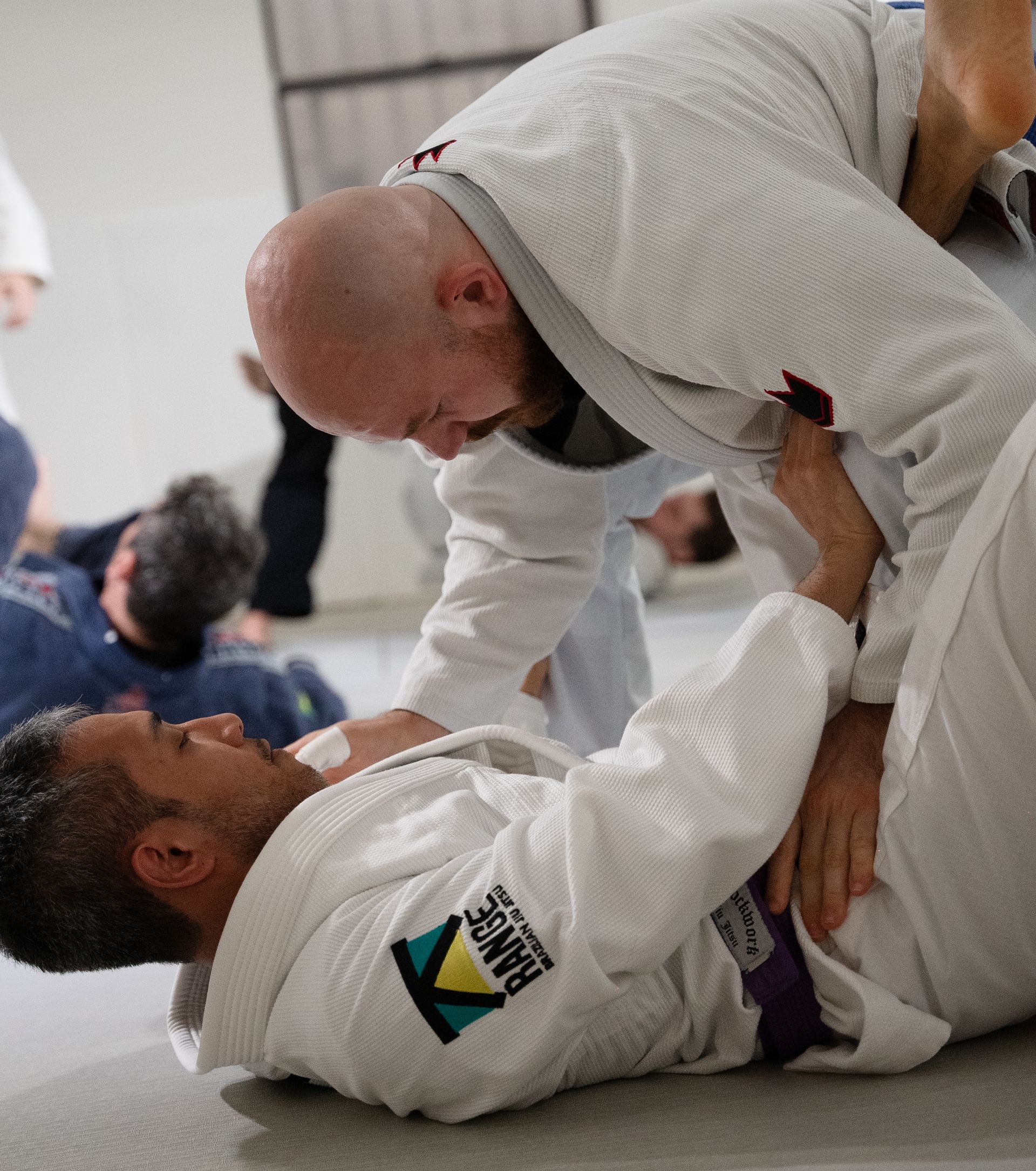 Adult students drilling Brazilian Jiu-Jitsu at Range Brazilian Jiu-Jitsu NYC in New York, NY.