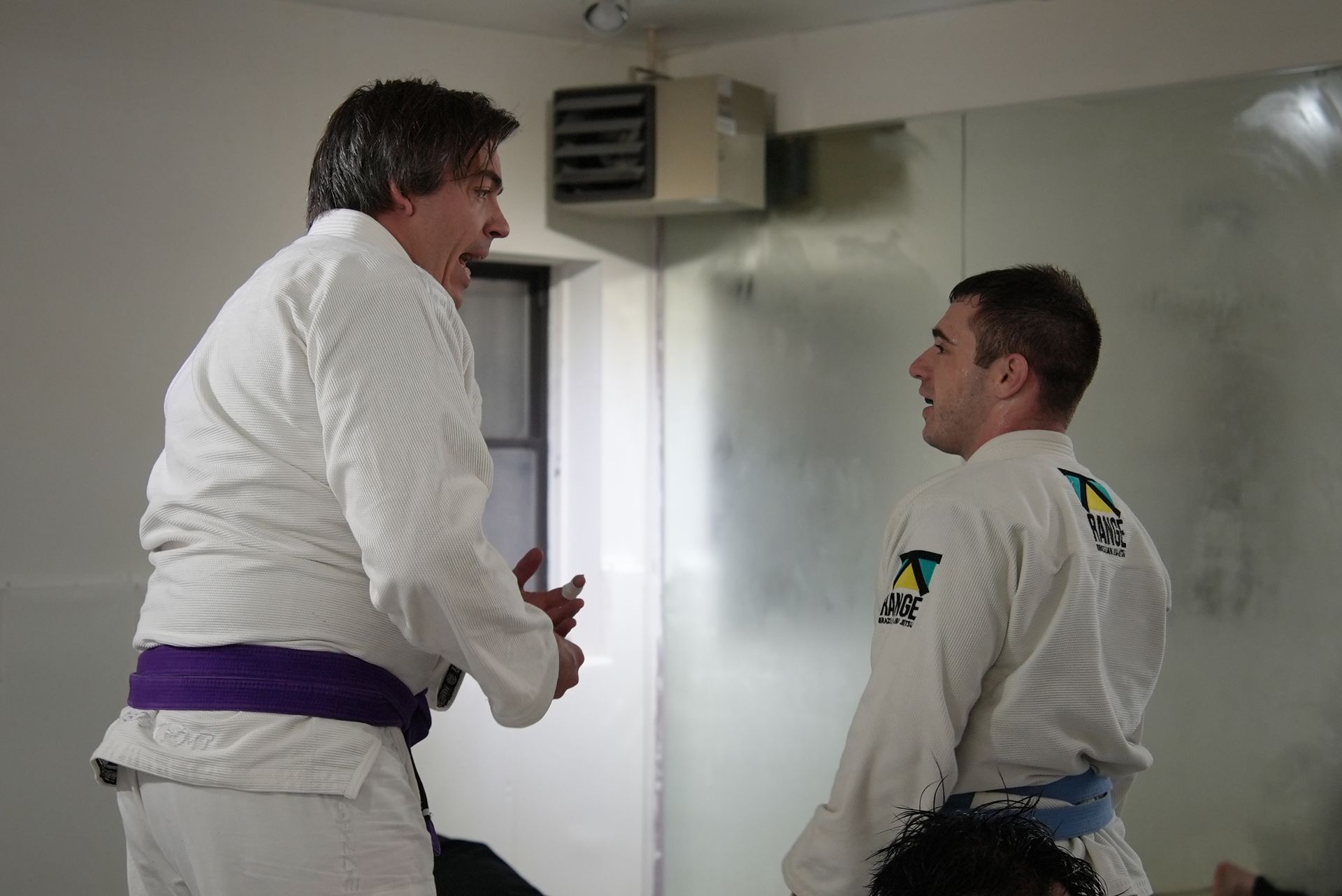 Students drilling Brazilian Jiu-Jitsu at Range Brazilian Jiu-Jitsu NYC in New York, NY.