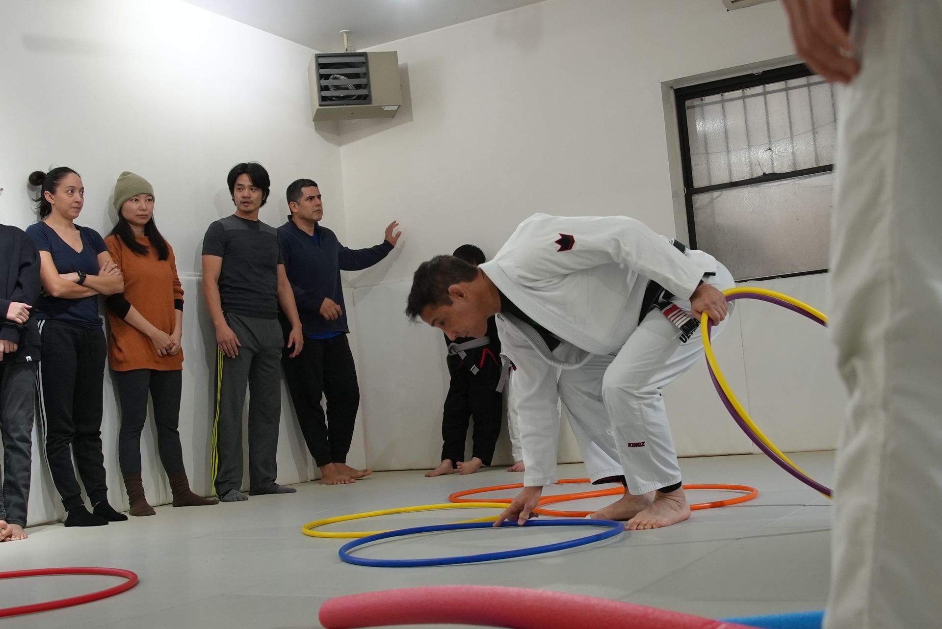 Students drilling Brazilian Jiu-Jitsu at Range Brazilian Jiu-Jitsu NYC in New York, NY for stress relief and wellness.
