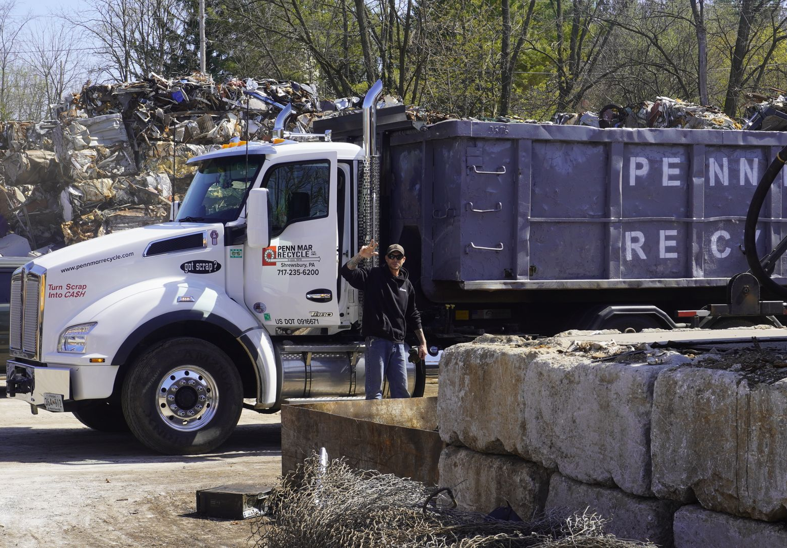 Pile of bent metal scaffolding and debris in a damaged industrial area