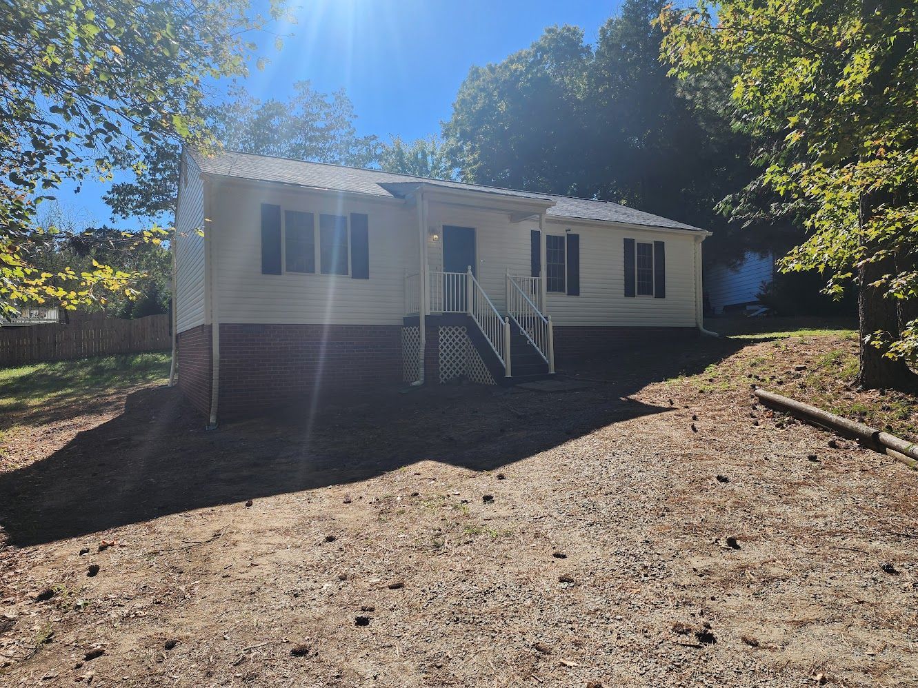 White rancher with brick foundation