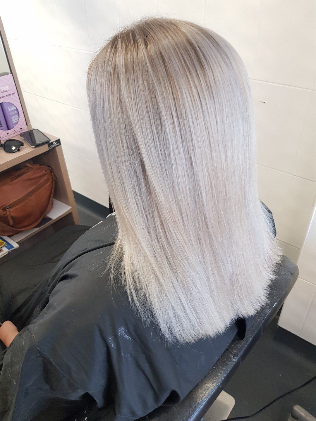 Side view of neatly styled blonde hair.
