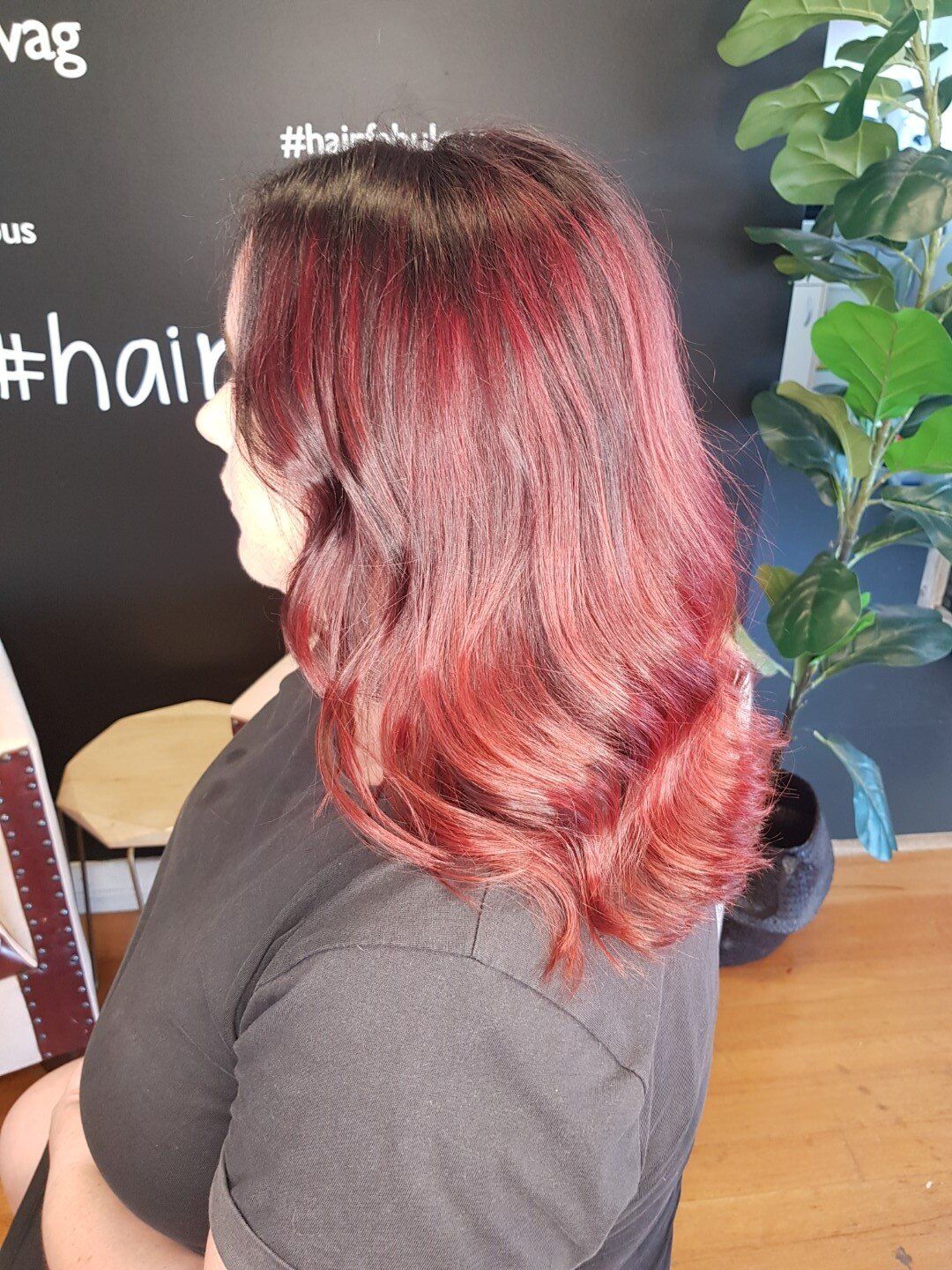 Back view of hair with red and blonde mixed tones.
