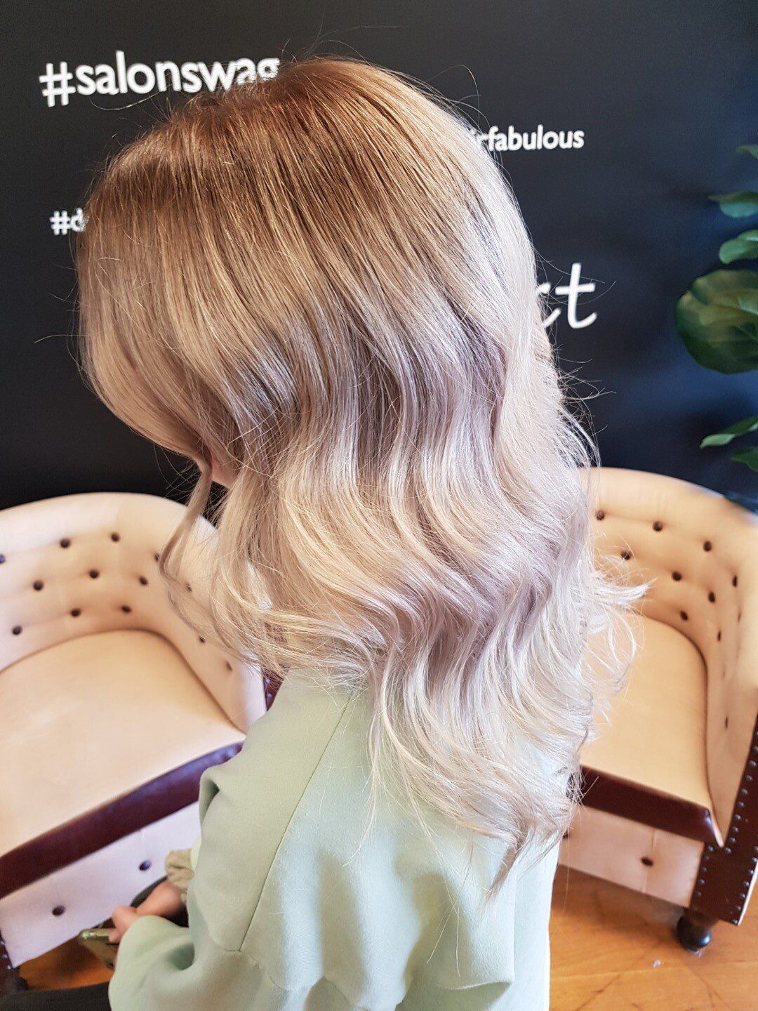 Side view of neatly styled blonde hair.
