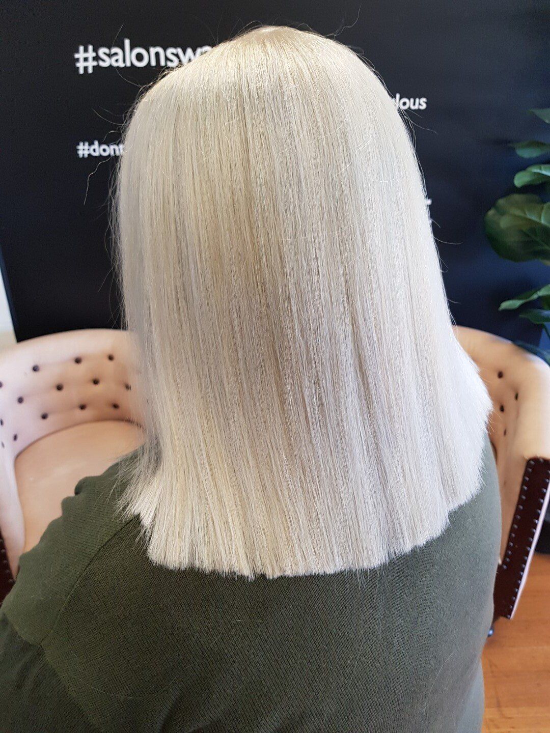 Shoulder length, straight blonde hair.
