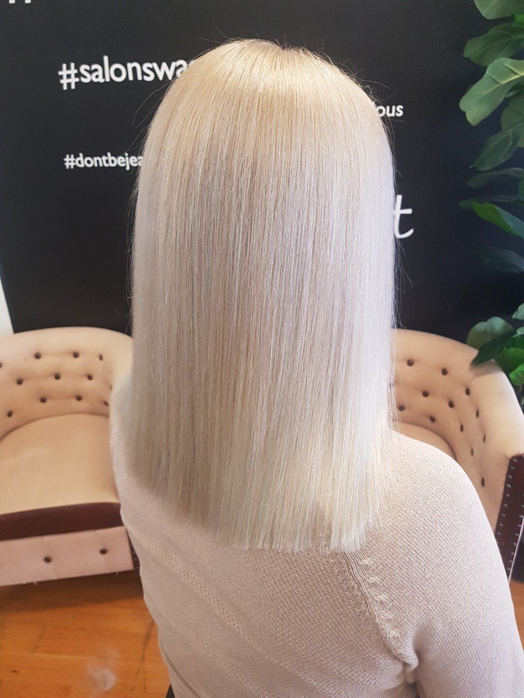 A blonde woman with a sleek bob haircut

