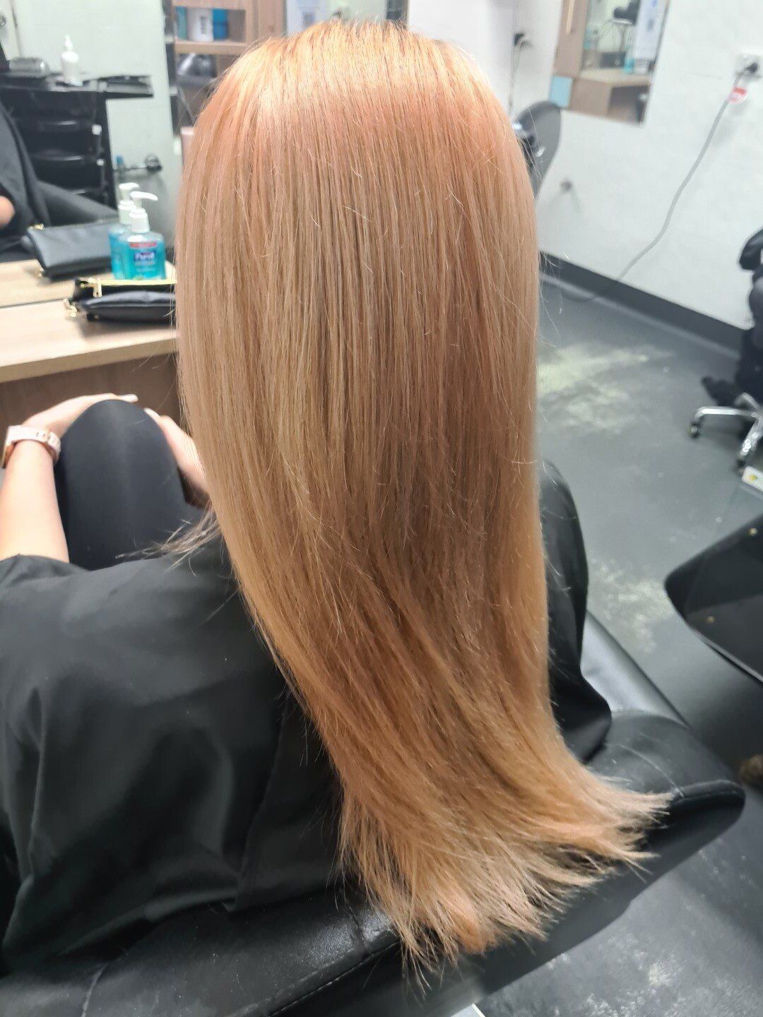 Rear view of hair with a warm brown tone.
