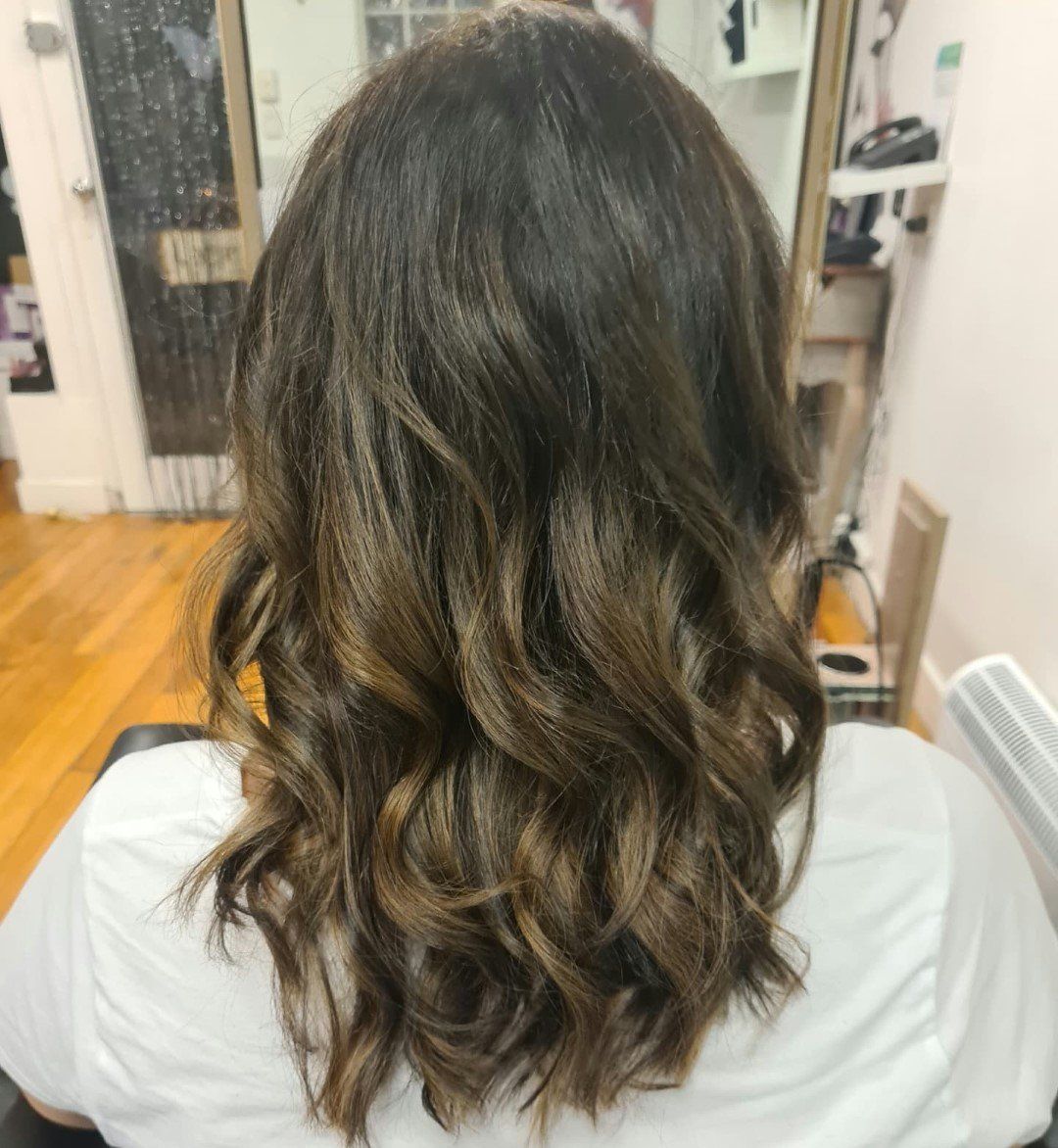 Back view of curly dark hair.
