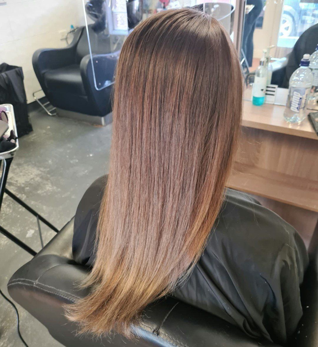 Close-up of red hair with noticeable split ends.
