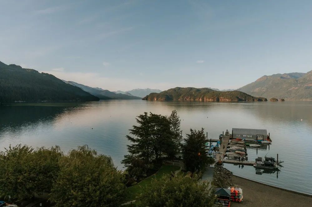 A large body of water with mountains in the background
