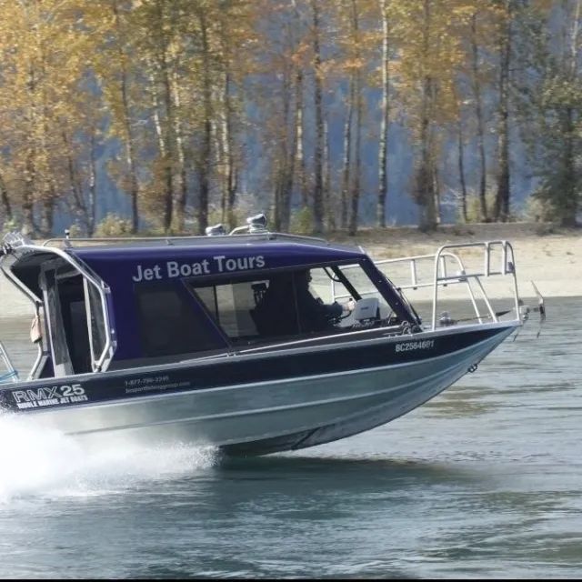 A boat that says jet boat tours on it