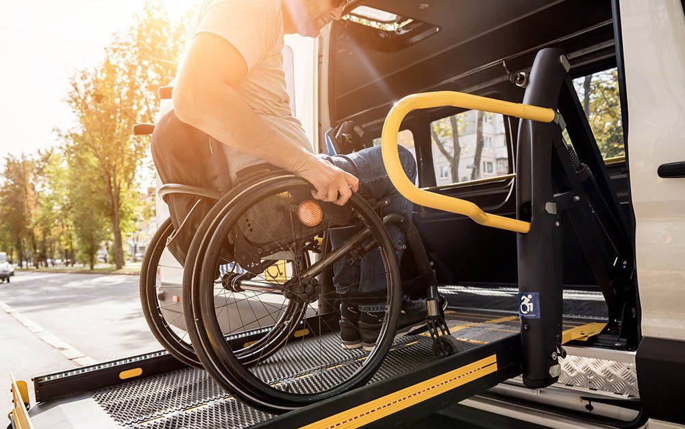 A Patient In Wheelchair Entering A Van — Bristol, TN — Ambulance Service of Bristol, Inc.