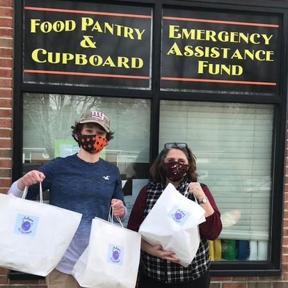 man and woman in front of food pantry