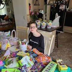 girl sitting with food bags
