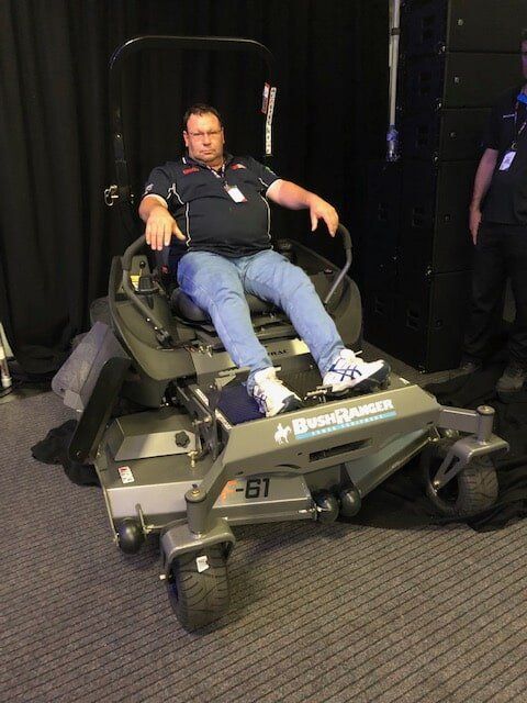 Worker on Bush Ranger Mower — Lawn Mower and Marine Servicing in Macquarie, NSW