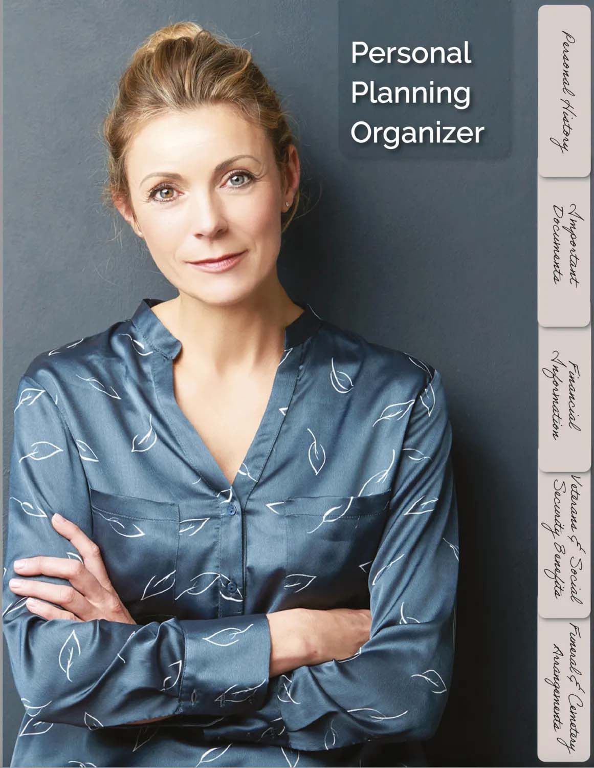 A woman is standing with her arms crossed in front of a personal planning organizer