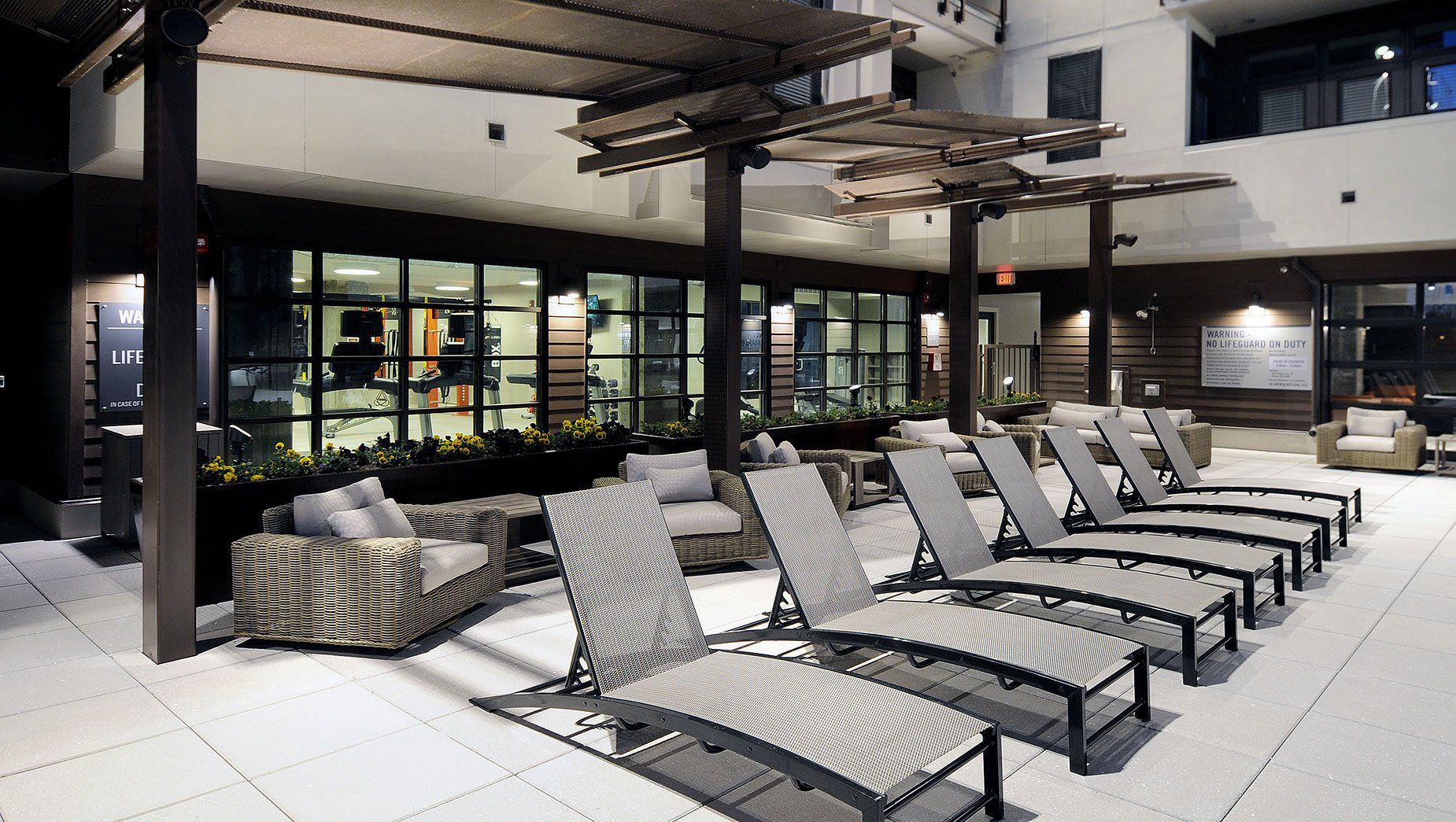Outdoor Poolside Lounge with Seating Area at North and Line