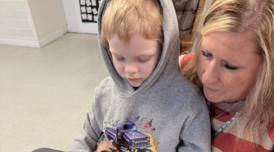 smiling boy in wheelchair