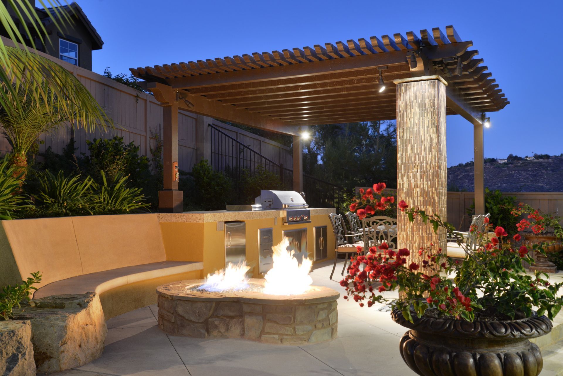 There is a fire pit in the middle of the patio.