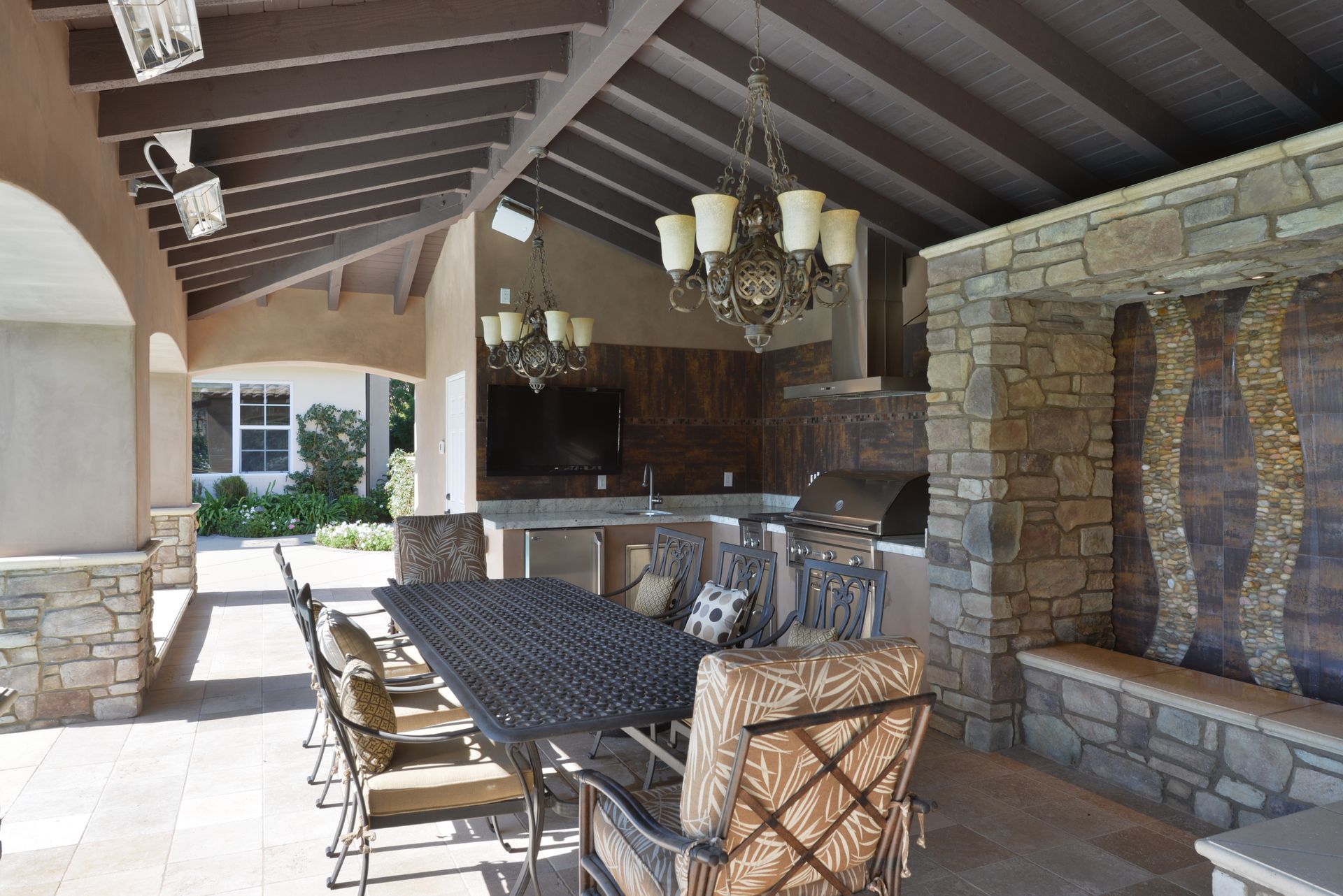 A large outdoor dining area with a table and chairs