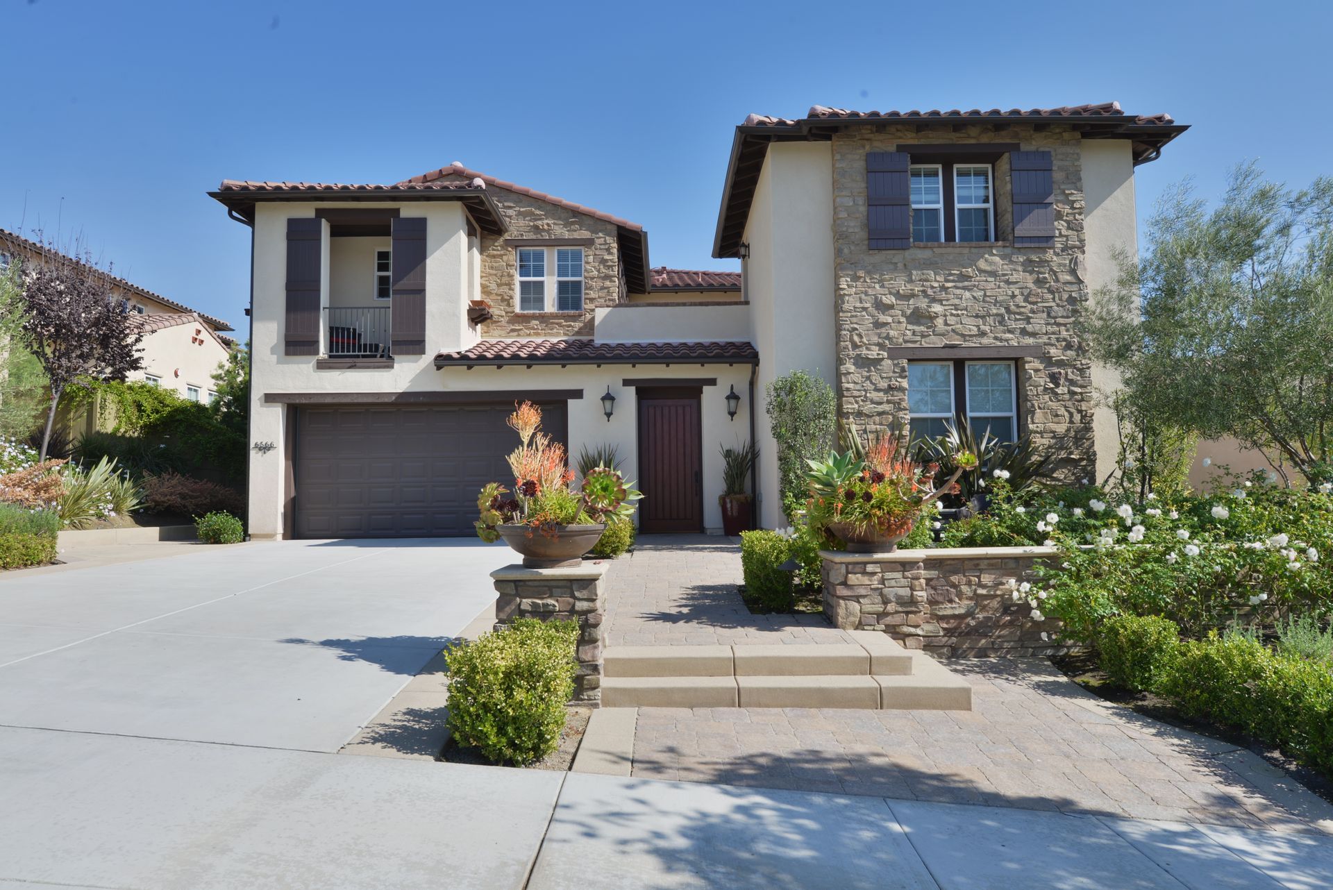 A large house with a driveway leading to it