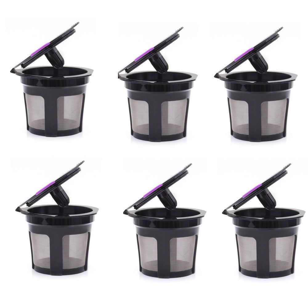 Six reusable, black plastic coffee pods with stainless steel mesh filters and purple lids, arranged in two rows.