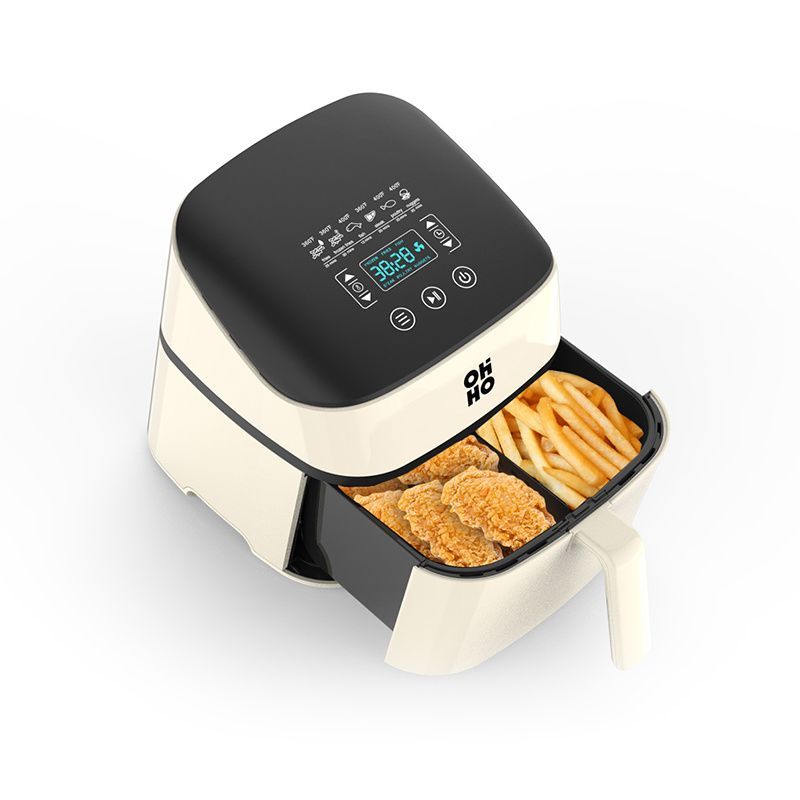 A cream and black air fryer with an open drawer containing fried chicken and french fries, viewed from a high angle.