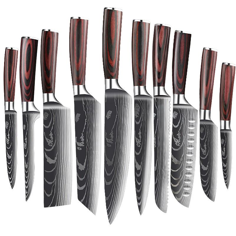 A set of six kitchen knives with dark wood handles and patterned Damascus steel blades lined up on a wooden surface.