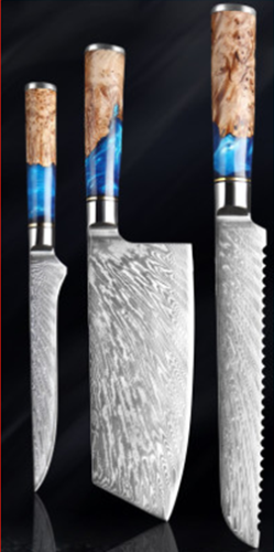 Three kitchen knives with Damascus steel blades and burl wood and blue resin handles against a black background.