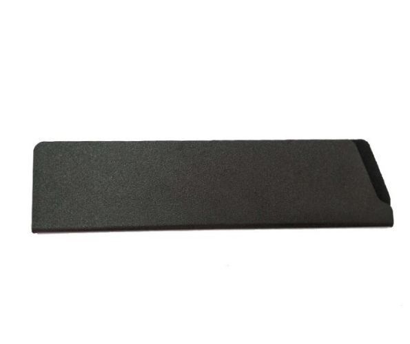 A rectangular, textured black surface with a beveled, angled edge on the right side.