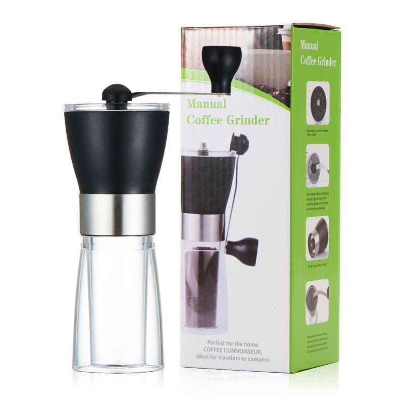 A manual coffee grinder with a black hopper, stainless steel band, and a transparent bottom chamber on a white background.
