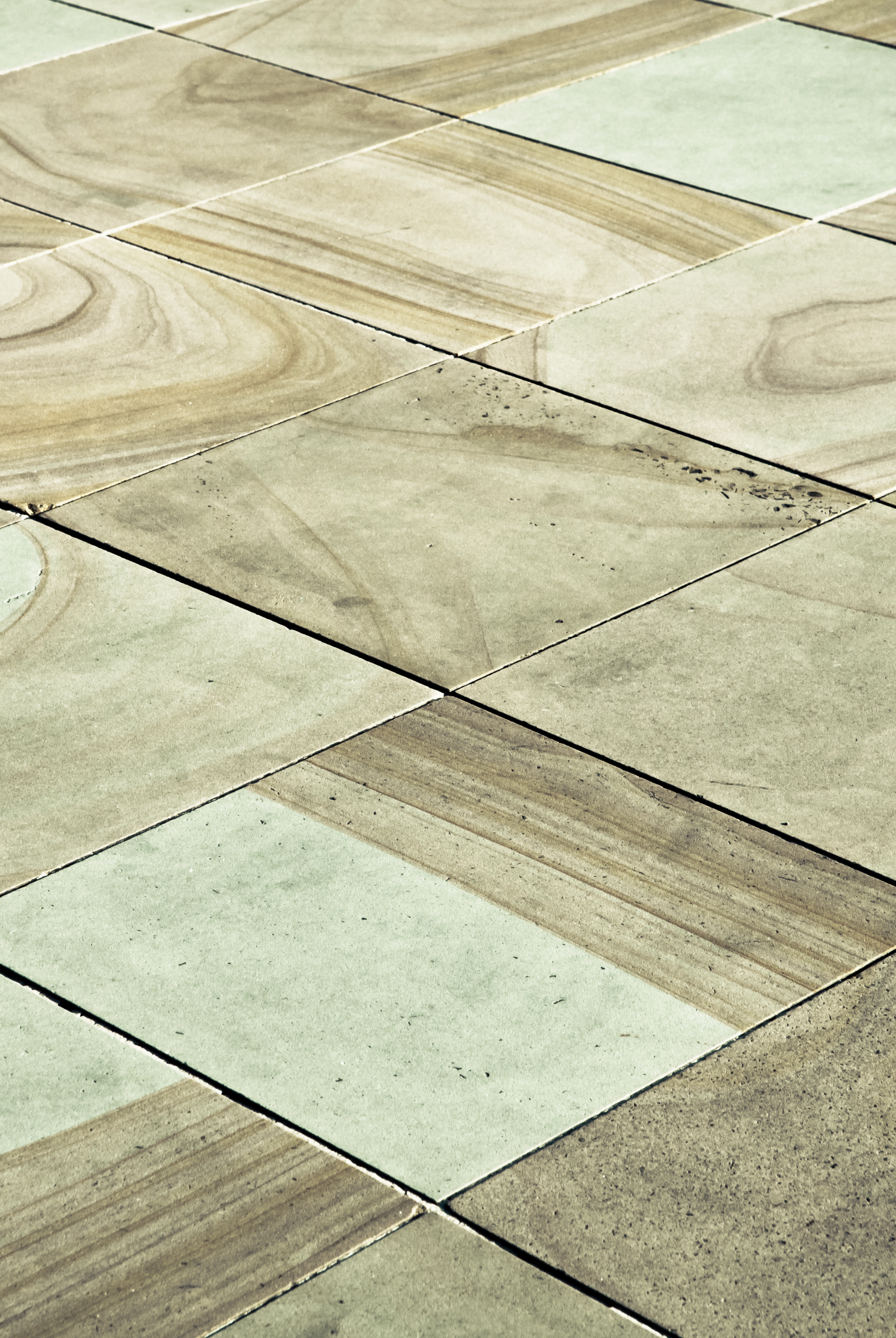 A close up of a tiled floor that looks like wood. Jarvis & Son Renovations,