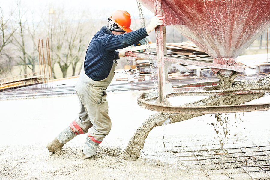 concrete contractor operating concrete mixer