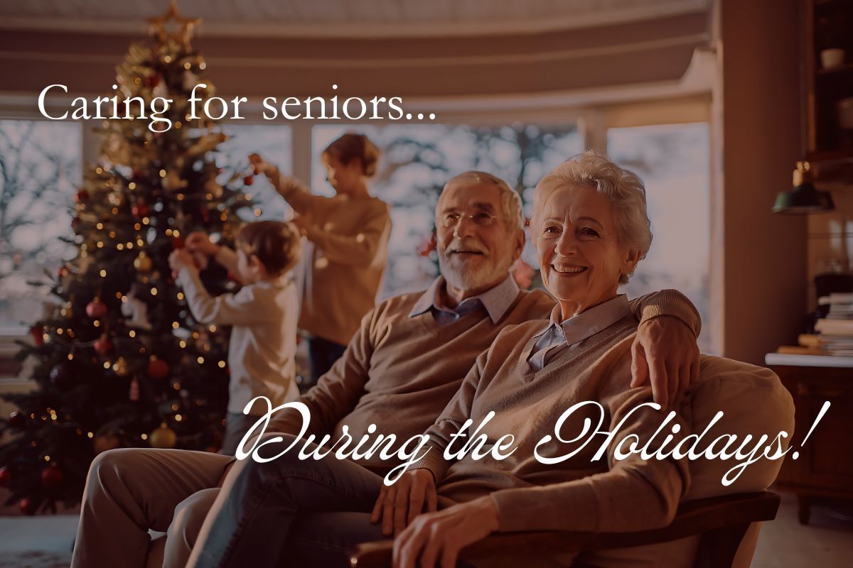 Elderly couple smiling, with family decorating Christmas tree in background.