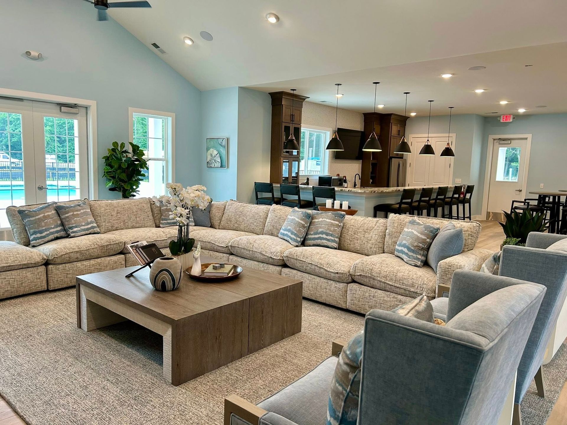A living room filled with furniture and a large sectional couch.