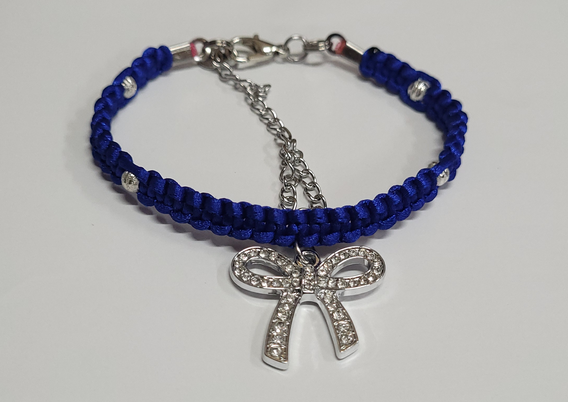 Royal Blue Macrame Bracelet/Anklet featuring a Silver Bow, fits from 6.5 to 10 inches, durable 316 stainless steel accents.