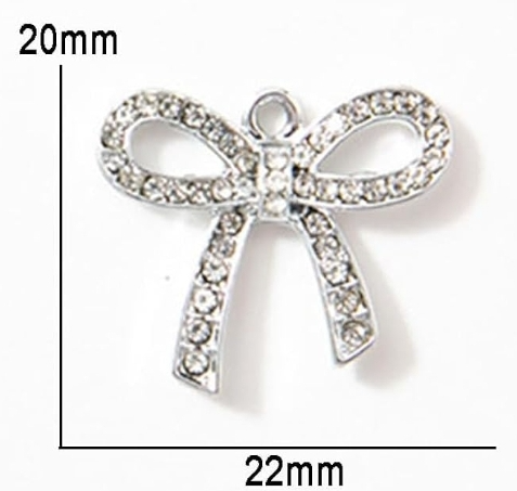 Pink braided pet collar with rhinestone bow charm.