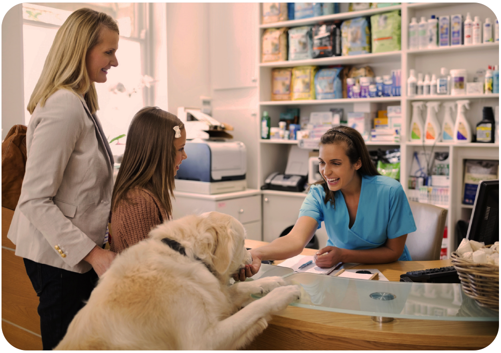 Family and dog at vet's reception