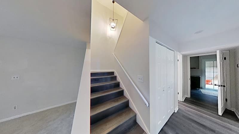 Restored foyer with new flooring and fresh paint