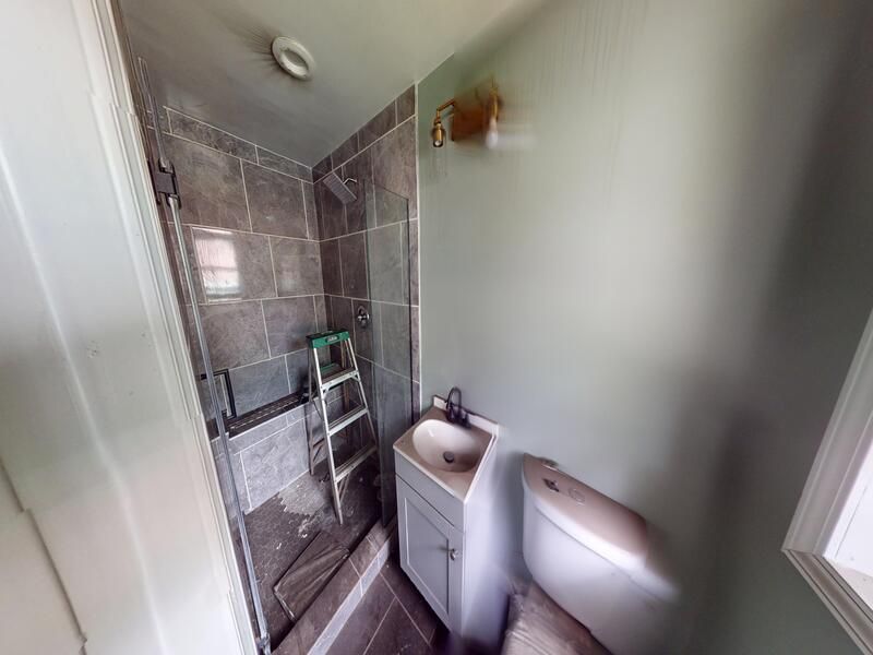 Additional bathroom fire damage before restoration