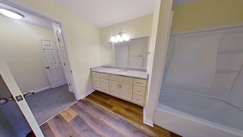 Bathroom fully restored after fire damage repair with clean tile fresh walls and recovered surfaces