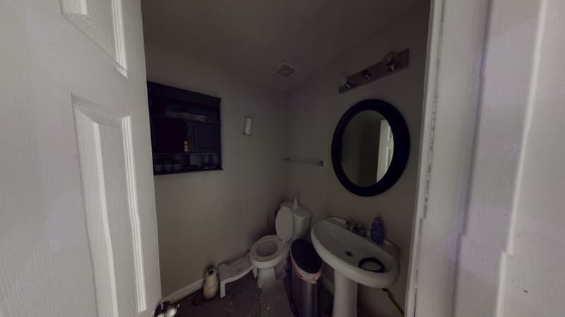 Bathroom with smoke and soot damage before professional fire restoration