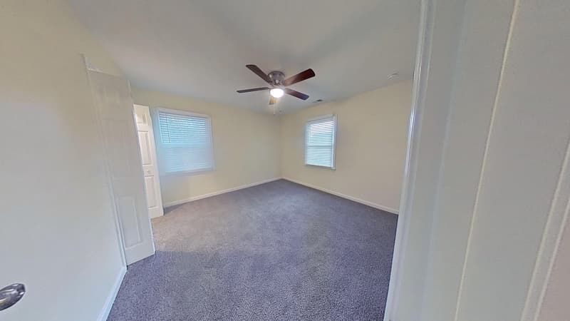 Bedroom area restored after fire damage with fresh walls and fully repaired surfaces