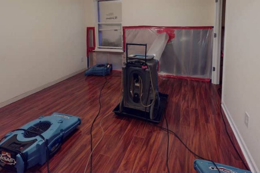 Professional dehumidifiers drying water damage