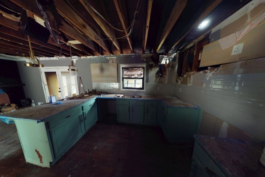 Kitchen with fire and smoke damage before professional restoration