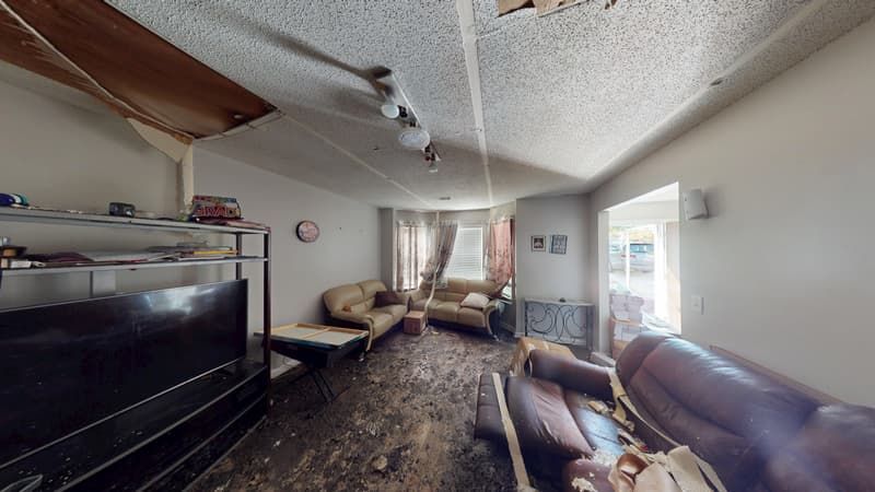 Second fire-damaged interior space before cleanup and reconstruction