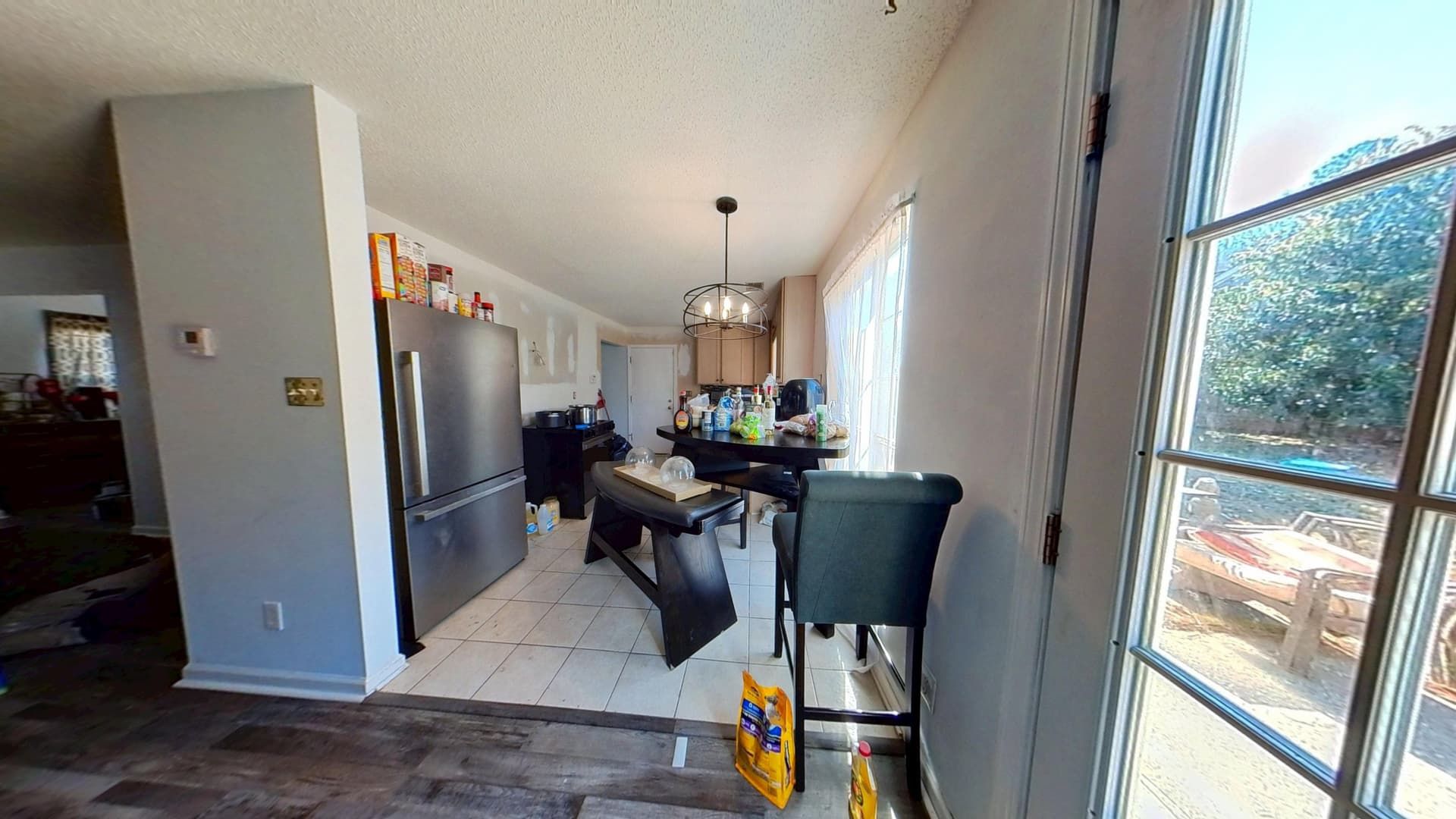 Restored kitchen with repaired cabinets and new flooring after water damage repair